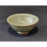 Small 19th century or earlier Chinese Celadon glazed footed bowl with internal incised motif.