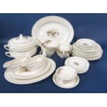 A Doulton Woodland pattern dinner service comprising dinner plates, side plates, soup bowls, stands,