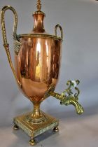 An elegant 19th century copper samovar with twin beaded brass handles and top, raised on a pierced