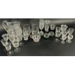 A mixed selection of glass ware including Victorian style etched glasses, small green base glass