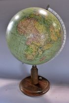 A mid 20th century schools world globe on an oak stand incorporating a small compass, 53 cm high