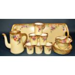a late 19th century hand painted tea service comprising six cups and saucers, teapot, sugar basin