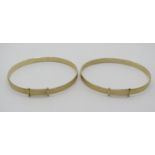 Pair of 9ct engine turned bangles, 12.7g total