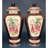 A pair of Chinese oviform vases and covers with character and foliate detail, set within blue and