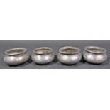 Four Indian Bidriware bowls, with silver inlaid fish with hole to base, 8cm wide
