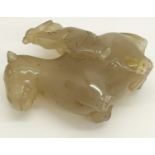 A Chinese pale carved jade figure, horse and rider (A/F) (partial) 7cm high, 17cm long (displayed in