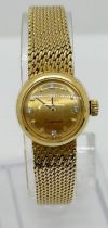 An Omega 18ct yellow gold Omega ‘Ladymatic’ wristwatch, the dial set with diamond markers, 18mm