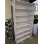 A painted floor standing open bookcase with fixed shelves 117cm w 206cm h