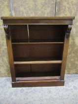 A Victorian mahogany veneered floorstanding open bookcase with two adjustable shelves flanked by