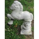 An unusual painted and weathered cast composition stone garden ornament or pier cap with rotating