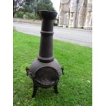 A cast iron chimenea (with cover)