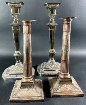 A pair of silver plated rounded square column candlesticks with gadrooned footing, 32cm high, and