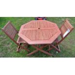 A contemporary folding hardwood garden table with octagonal slatted top, together with a pair of