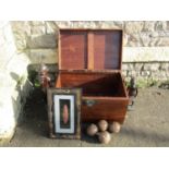 A contemporary hardwood chest with hinged lid plus contents including two carved hardwood figures,