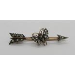 Victorian rose cut diamond set arrow brooch with central butterfly, in yellow metal with white metal