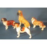 Four Melba ware dogs to include a Boxer, a Terrier, a Sheltie and a St Bernard