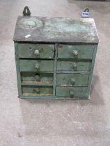 A small old painted pine wall mounted chest of eight small drawers 36 cm wide x 21 cm deep x 34 cm