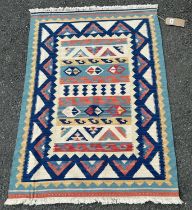 A North African Kilim Rug, with tribal design in pastel tones, 83 x 180 cm