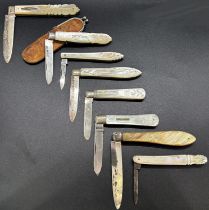 A collection of eight mother of pearl and silver fruit knives, various makers, one in a leather clip