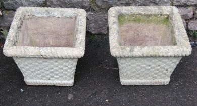 A pair of painted and weathered cast composition stone lattice basket planters of square tapered