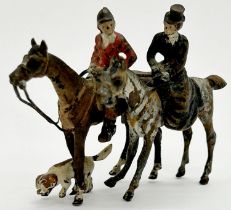 Miniature cold painted bronze hunting group, gentleman in pink, the lady mounted side saddle, with