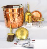 A 19th century beaten copper coal bucket with a brass loop handle, a brass ember shovel and brush, a