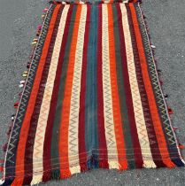 A south west Persian Jajim Kilim, with vibrant stripes and multicoloured knots and tassels, 215cm