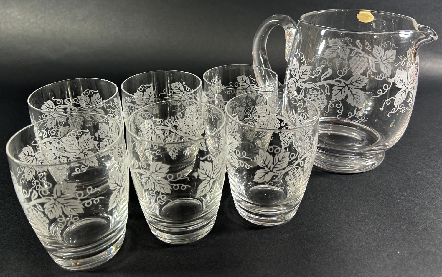 Collection of mid-20th century Stuart Crystal glasses including a vine leaf decorated jug and six
