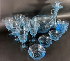 A set of six pale blue bubble glass wine glasses, with related bowls, a fruit bowl, candlestick,