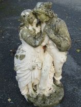 A partially painted and weathered composition stone Romeo and Juliette garden ornament, 70 cm high