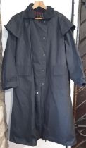 'Stockman's Coat' jacket by Backhouse (Barbour Co), in dark blue heavy weight waxed cotton with