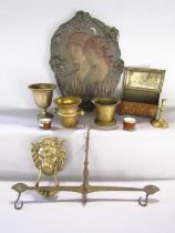 A selection of 18th and 19th century brass ware including a lion head door knocker, a chalice, two