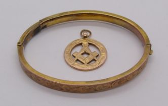 1920s 9ct Masonic pendant together with an antique 9ct hinged bangle (af), 10.7g total