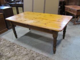A pale pine farmhouse kitchen table, 73cm high, 184 x 102cm