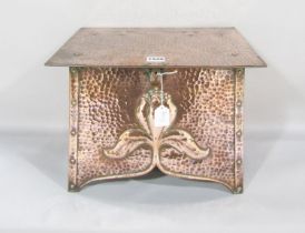 An Art Nouveau copper tinder box with tulip head to the front panel, 38cm wide x 29cm high