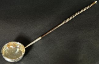 A silver metal toddy ladle with twisted cow horn handle, 42 cm long