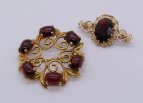 Two stylised vintage 9ct garnet set brooches, 8.4g total