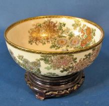A 19th century Japanese Satsuma porcelain bowl, decorated with chrysanthemum and other blossoms,