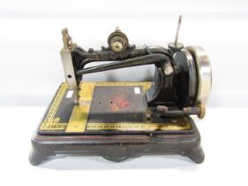 Howe Victorian Howe lockstitch sewing machine with geometric and floral decoration with shuttle