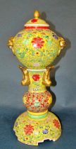 A decorative Chinese export lidded censor on stand, decorated throughout with floral motifs over a