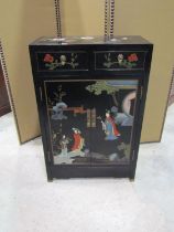 A decorative japanned lacquered cabinet, decorated in the chinoiserie style, painted with figures,
