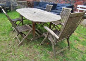 A weathered Marlborough teak D end extending garden table with single additional leaf (af