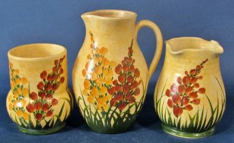 A collection of Radford pottery items to include jugs, vases, bowls, all decorated throughout with