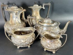 A five piece silver tea and coffee service with heavily scrolled decoration, Chester 1905, maker