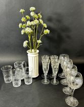 Ten Champagne flutes on slender pink stems, further flutes and wine glasses, decanters, jug, etc