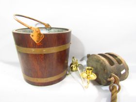 A reproduction brass bound oak peat/ coal bucket with zinc liner, a ship's pulley and an Arts &