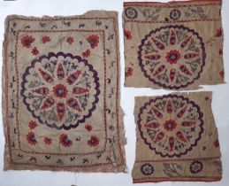 A small Uzbek type Suzani panel, probably 19th century with hand embroidered red and purple floral