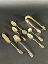 A selection of silver tableware including a William IV sugar tong London 1834 makers Charles Boyton,