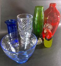 A mixed selection of mid to late 20th century glassware to include a tall red vase, a pale blue