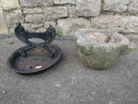 A weathered stone mortar (32cm diameter) and a cast iron boot scraper (2)
